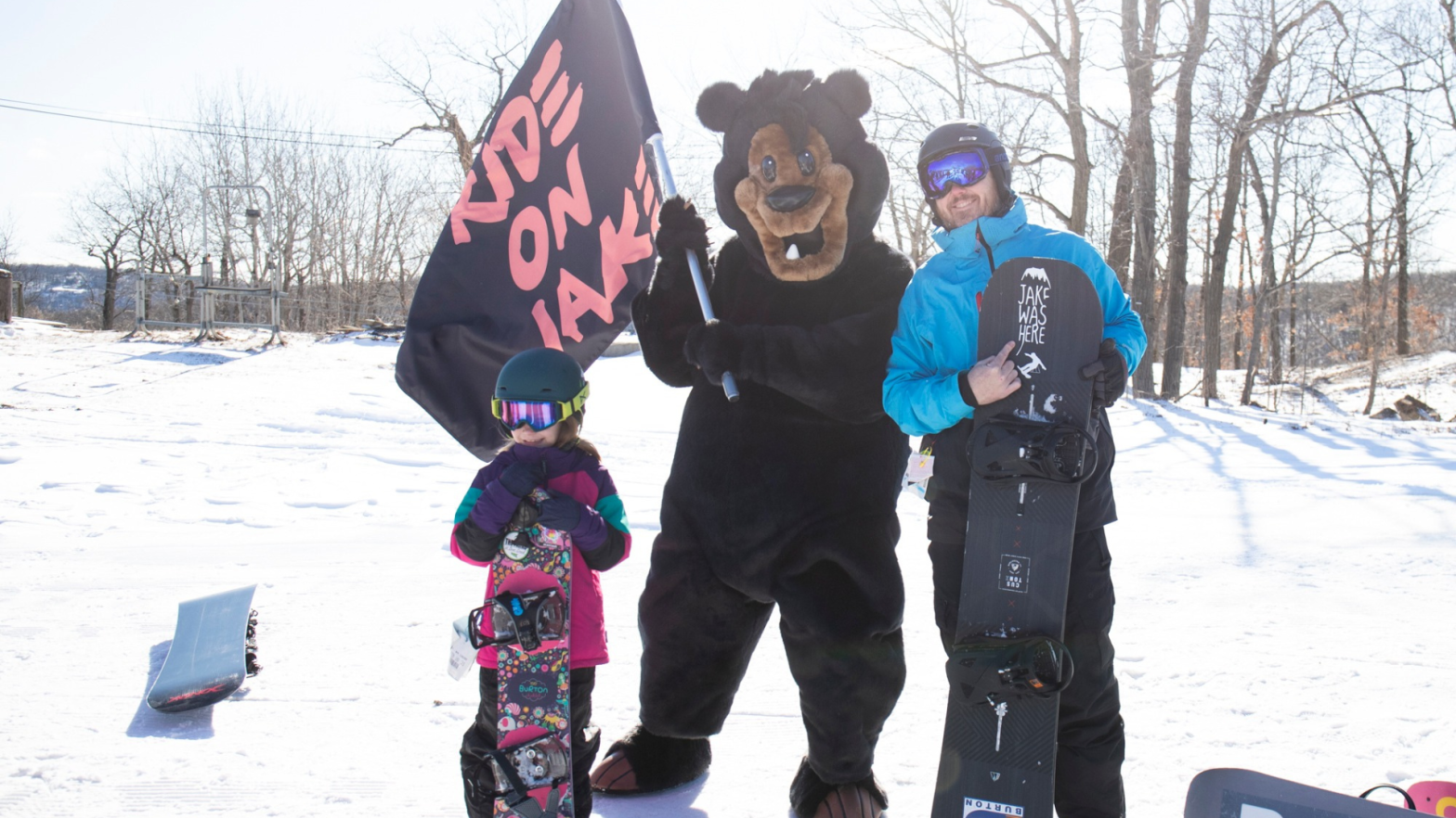 Two snowboarders smiling with Vern at the Day for Jake event at Mountain Creek in Vernon, New Jersey.